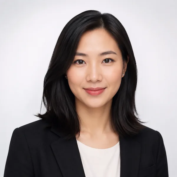 Studio Classic AI headshot example — professional woman in her 20s (AI-generated, not a real person)