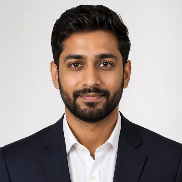 Studio Classic AI headshot example — professional man in his 30s with a beard (AI-generated, not a real person)